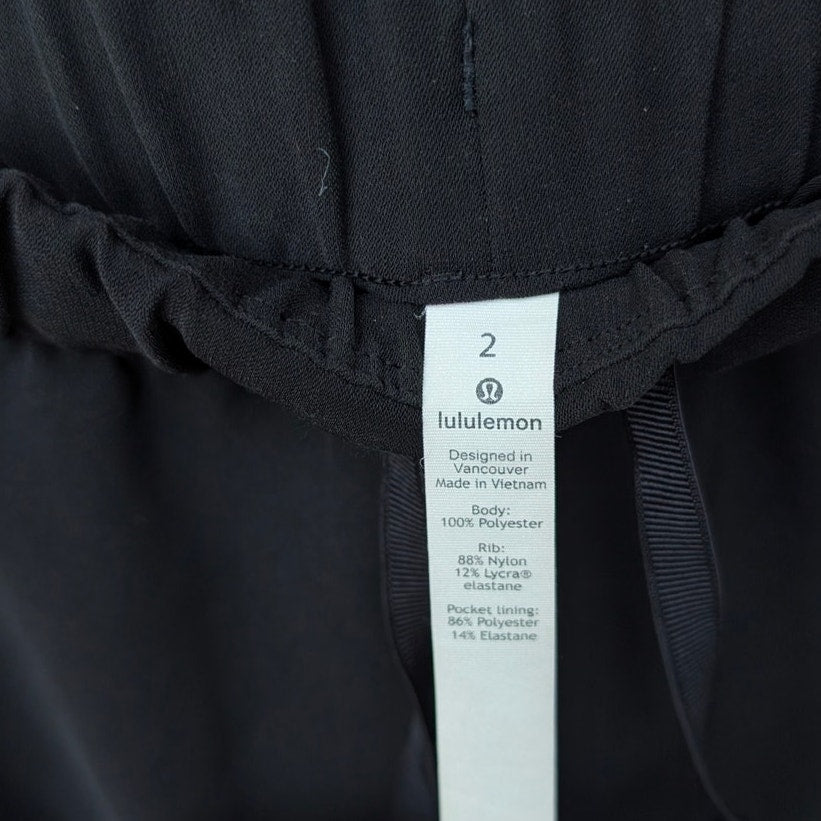 Lululemon W5BZDS Black On The Fly Jogger Tapered Leg Mid-rise Pants, size 2
