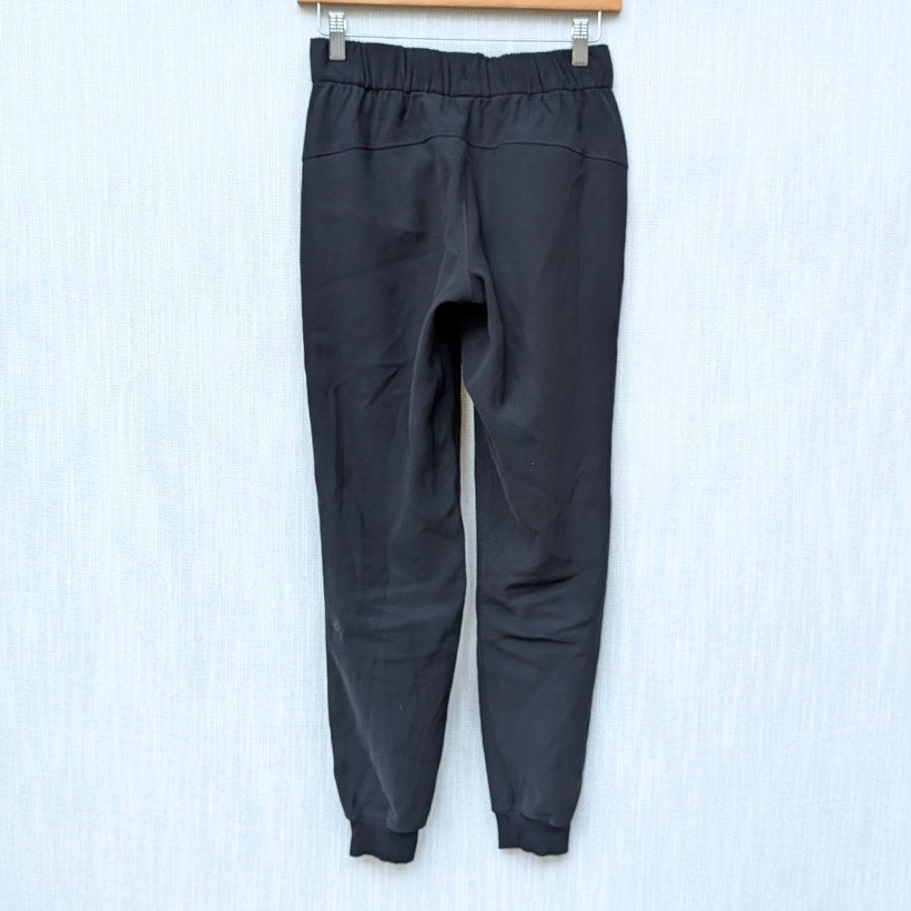 Lululemon W5BZDS Black On The Fly Jogger Tapered Leg Mid-rise Pants, size 2